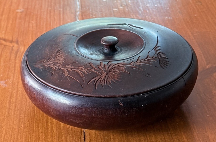 Round carved wood lidded trinket box with floral carving