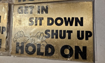 Gold, ''Get In Sit Down Shut Up Hold On'' Small Metal Dashboard Sign NOS