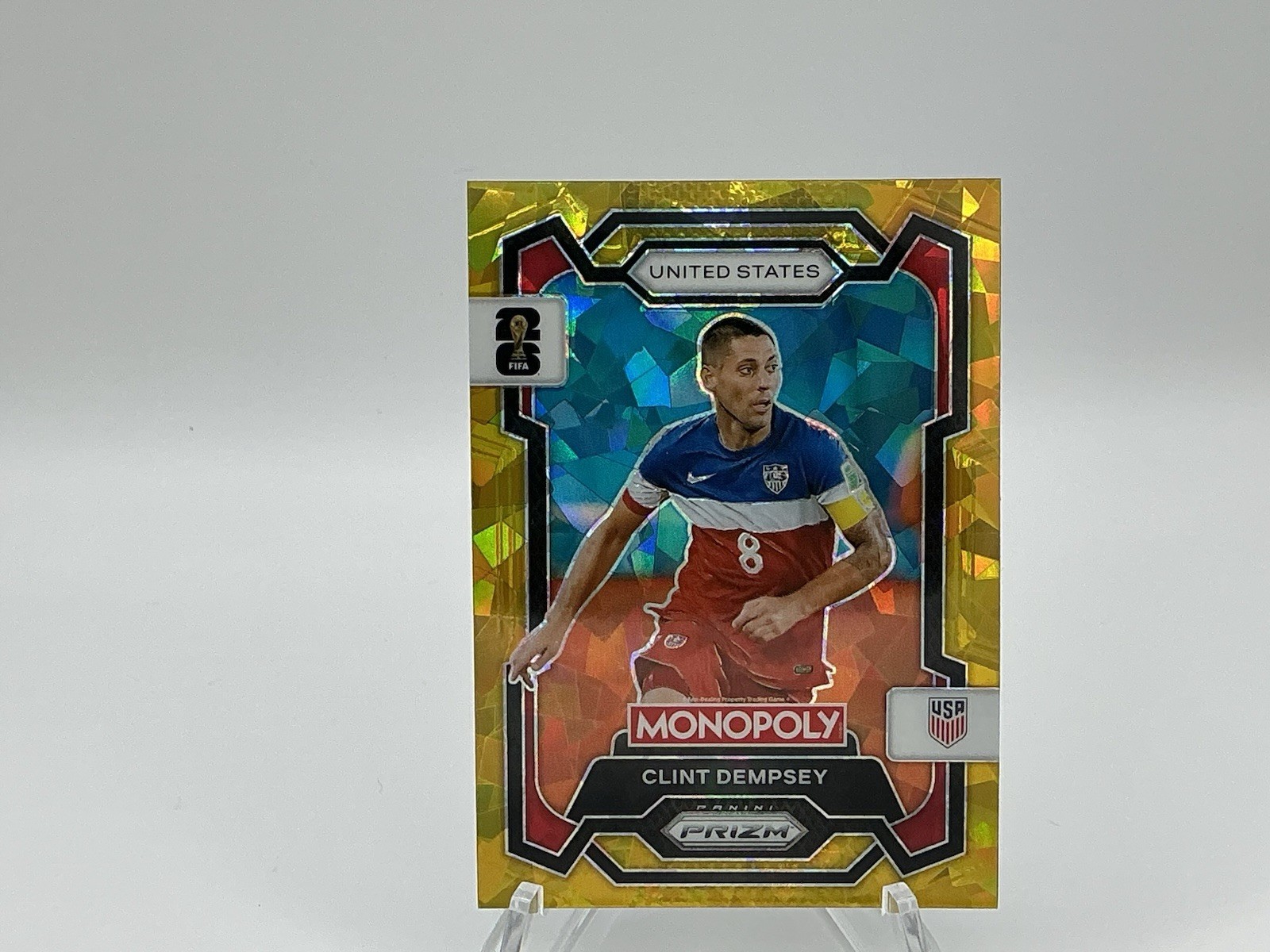Panini 2026 Prizm Monopoly FIFA World Cup 26 Clint Dempsey #51 GOLD CRACKED ICE