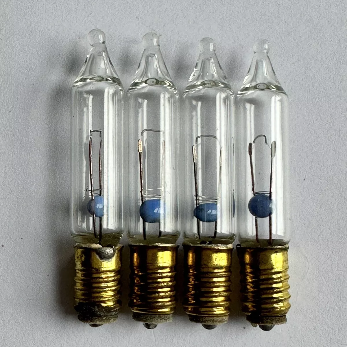 4 x CLEAR Genuine Noma 12v E5 1.1w Lilliput 12 volt Spare