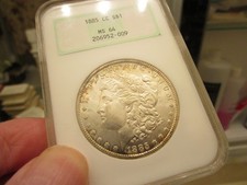 MUCH BETTER DATED 1885-CC MORGAN DOL NGC MS 64 OLD HOLDER & LOOKS NICER TO ME