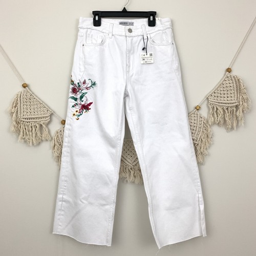 white distressed flare jeans