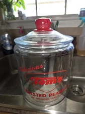 Vintage Tom’s Toasted Peanuts Clear Glass Jar-Red Handled Lid.  Apprx 10" Tall
