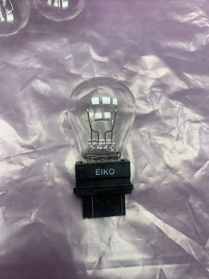 New Box of 10 Eiko 3057 Brake Light-Base Fits Vehicles Listed on Chart Below - Image 2 of 4