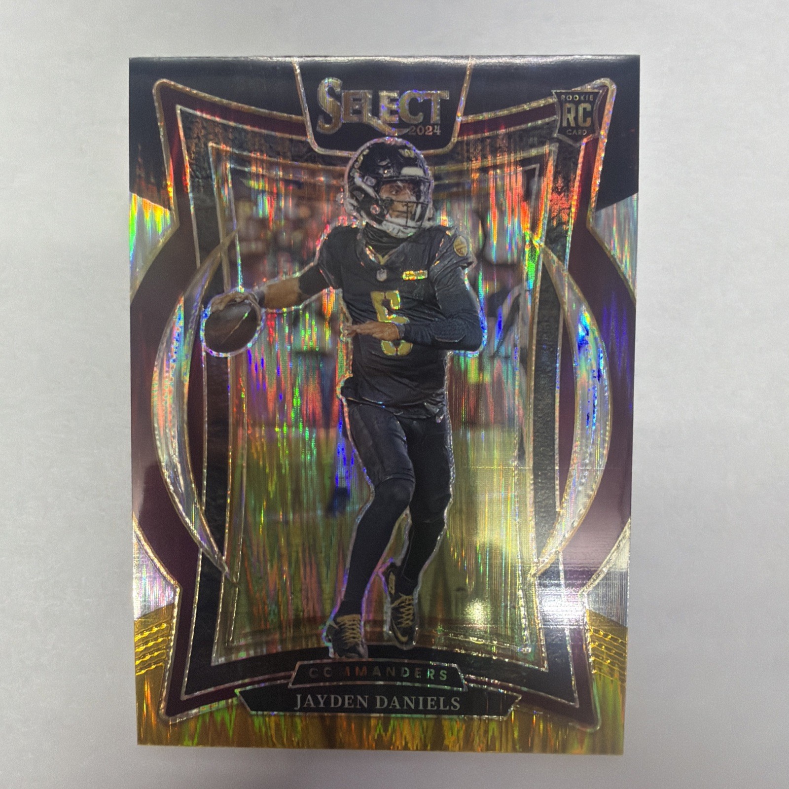 2024 Panini Select - Concourse Jayden Daniels #26 Red & Yellow Shock Prizm (RC)