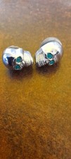 Chrome decorative green eyed bolt on skulls x2