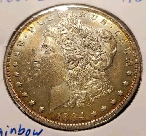 1884 O Morgan Silver Dollar. Guaranteed Authentic Nice Coin.  AU Rainbow Toning