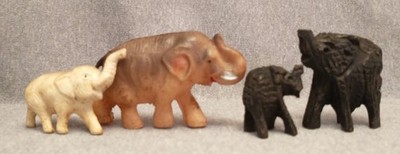 Herd of 4 small vintage Elephants Celluloid, Plastic, and carved possibly wooden