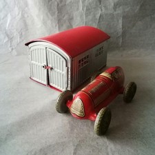 Super rare tin wind-up car with garage, American occupied Germany, with box,