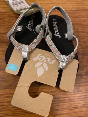 reef twisted stars flip flops