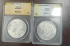 TWO 1921 MORGAN SILVER DOLLARS ANACS MS62. TWO COINS IN LOT