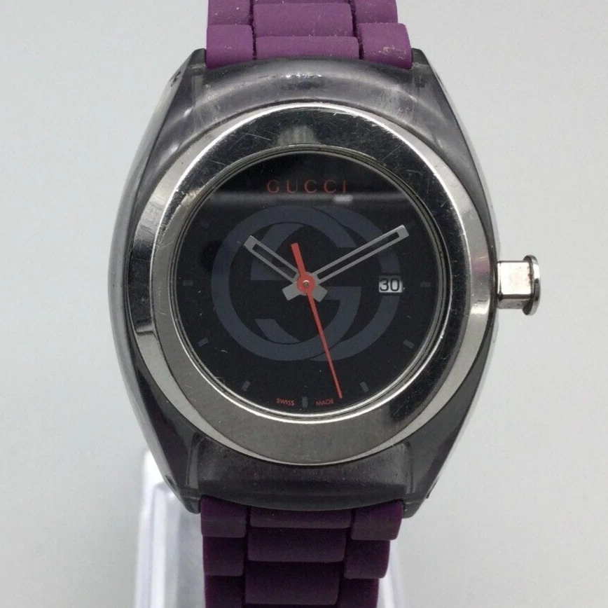 Montre Gucci Sync femme 34 mm ton argent violet date noire fabrication suisse pile neuve