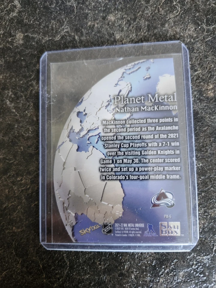 2021-22 SkyBox Metal Universe Planet Metal Nathan Mackinnon Card# PM-5 - Image 2 of 2