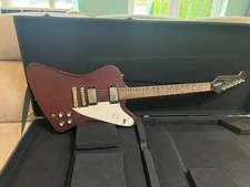 Epiphone Firebird Studio in a great Worn Mahogany finish, with hard case.
