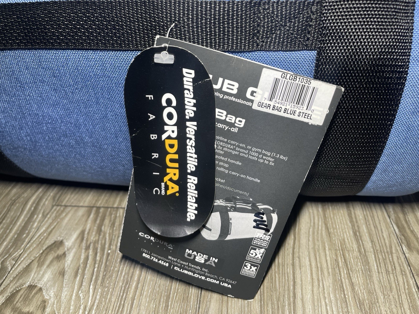 Blue and navy Cordura Club Glove golf bag with black tag, white logo, and “Made in USA” text on front.