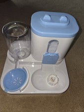 Cat Feeder And Leash With A Harness.