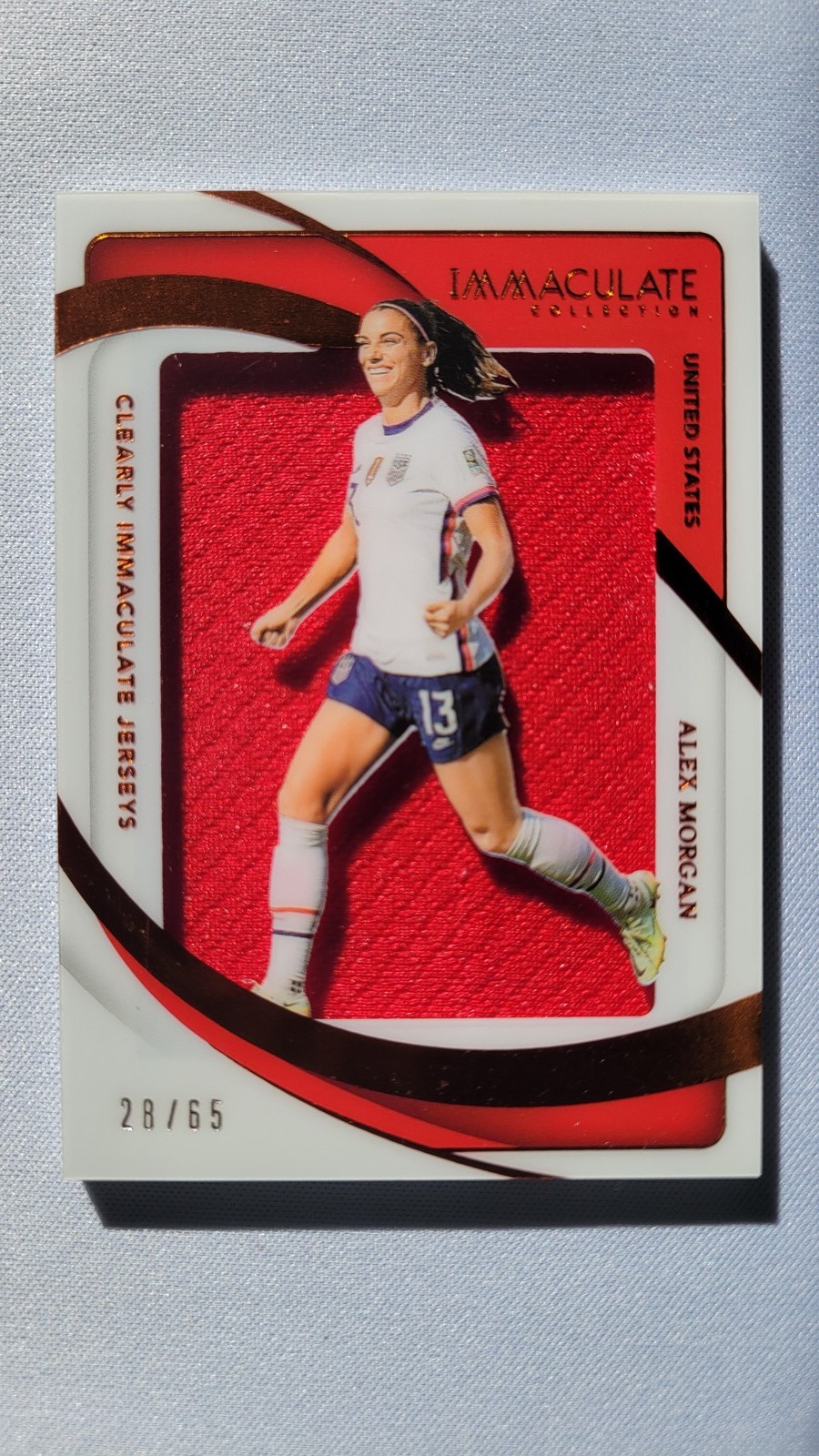 2024-25 Panini Immaculate Collection #CJ-AMO Alex Morgan Clearly Jerseys #/65