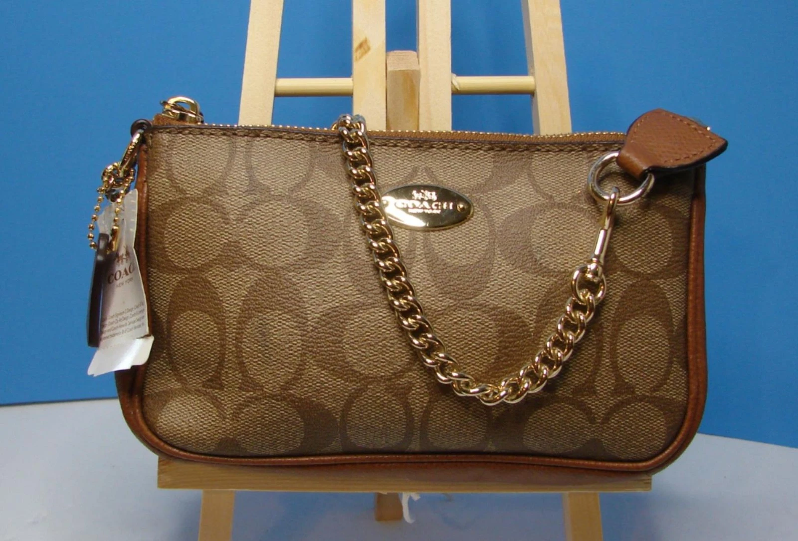 Borsa a tracolla Coach Signature rivestita in tela Nolita nuova con etichetta con difetti