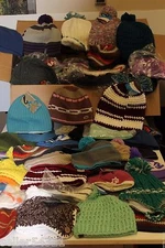 Lot of 50 mixed bag of beanies and caps. Mixed manufacturers and styles. 