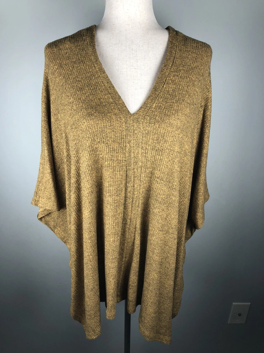 Poncho sweater with store arm holes