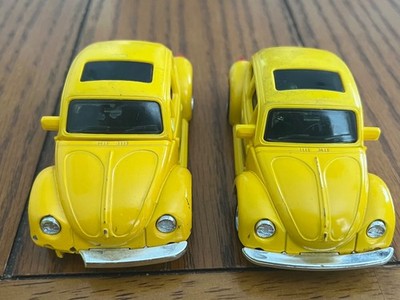 lot of 2 1983 Bandai Transformer Volkswagen Beetles for parts or repair. As Is