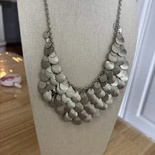 Many Shinny Circles In Silver Two Sizes.  Hanging From Webbed Chains.   Necklace
