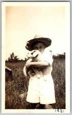 Vtg B&W Snapshot Boy in Straw Hat Holding Puppy Dog Outdoors Field 1931