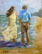 Couple Walking On The Beach