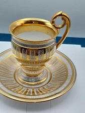 RARE ANTIQUE DRESDEN demitasse cup and saucer SET. extensive gold gilding. 