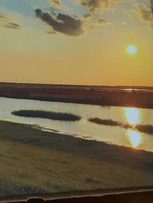 Sunset Canvas Wall Art with the sun setting over a peaceful stream. 16x20