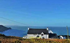 Photo 6x4 Pwll Deri Youth Hostel Trefasser Looking west from the cliff to c2015