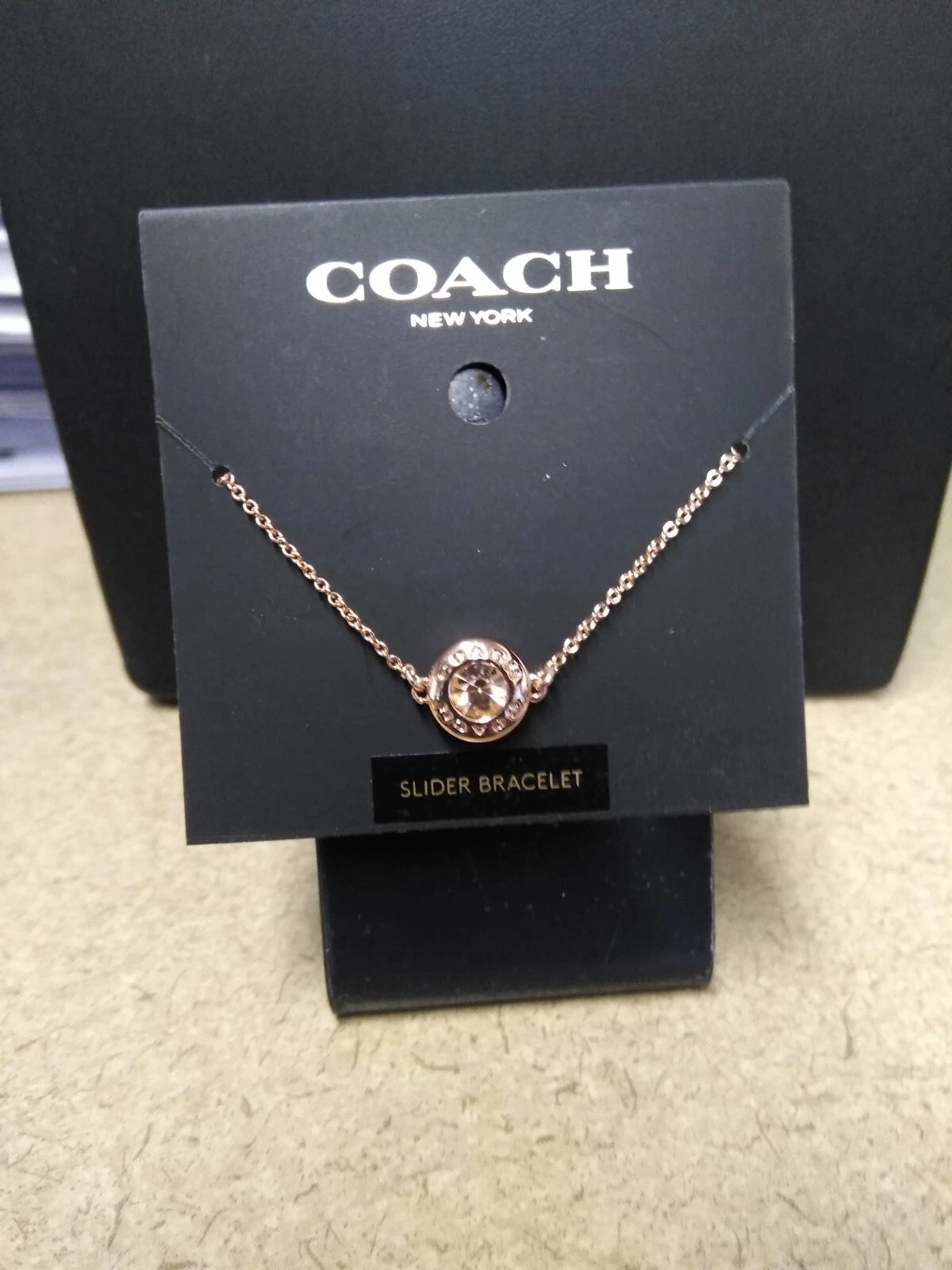 COACH Bracciale Slider Cerchio Aperto Cristallo Oro Rosa Regolabile Minimo Delizioso
