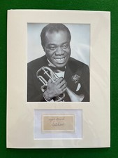 GENUINE HAND SIGNED LOUIS ARMSTRONG INDEX CARD SIGNED ‘SATCHMO’ ON BIO PAGE.