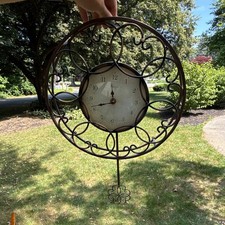 Round Brown Metal Scrollwork Hanging Wall Clo...