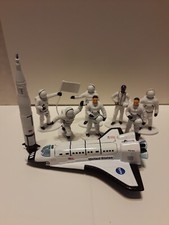 Lot of 9 Astronaut Figures a Metal Shuttle and Rocket