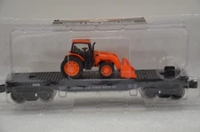O GAUGE CHGO. NORTHWESTERN FLAT CAR WITH KUBOTA TRACTOR NEW