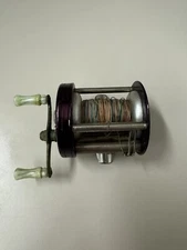 Vintage South Bend no. 15 fishing reel W/ Multi Colored Fishing Line.
