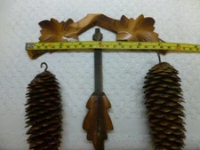 Cuckoo Clock Parts Lot Vintage crown, pendulum and two pinecones.