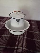 white enamelware coffee pot, also known as a percolator, and a matching Basin