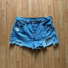 Vintage 90's essential woman's distressed Levi's cutoff shorts size 34 