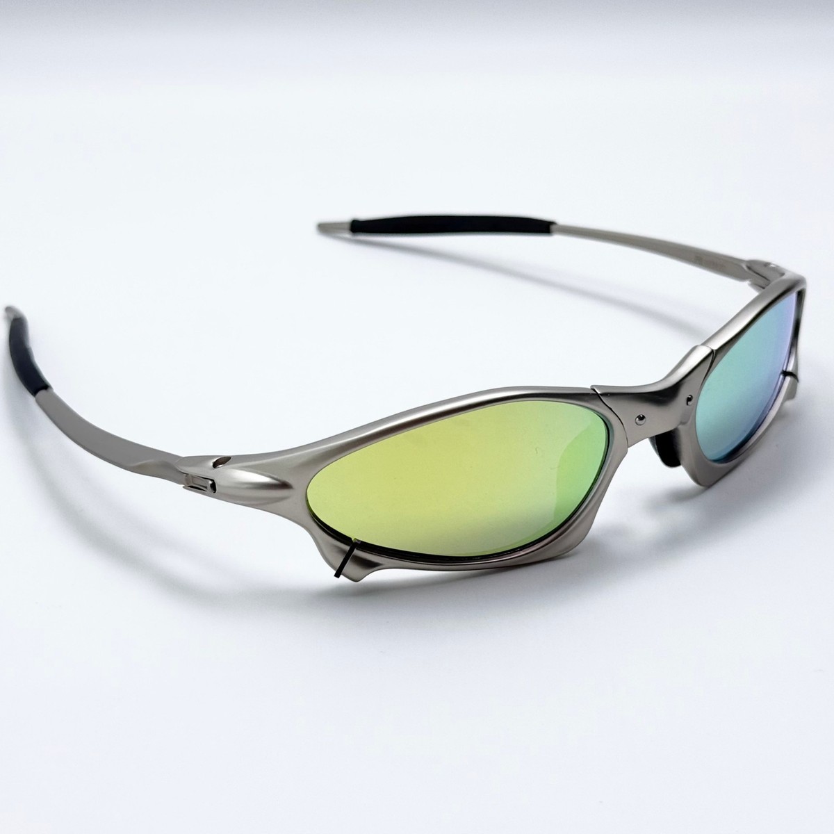 Oakley Penny X-Metal Sunglasses Silver Frame Yellow Iridium Lens
