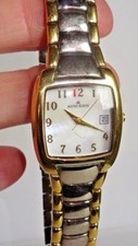 RELOJ ANNE KLEIN AK TONO PLATEADO Y DORADO CON CORREA DE ESLABONES METÁLICOS 10/7197 QTZ