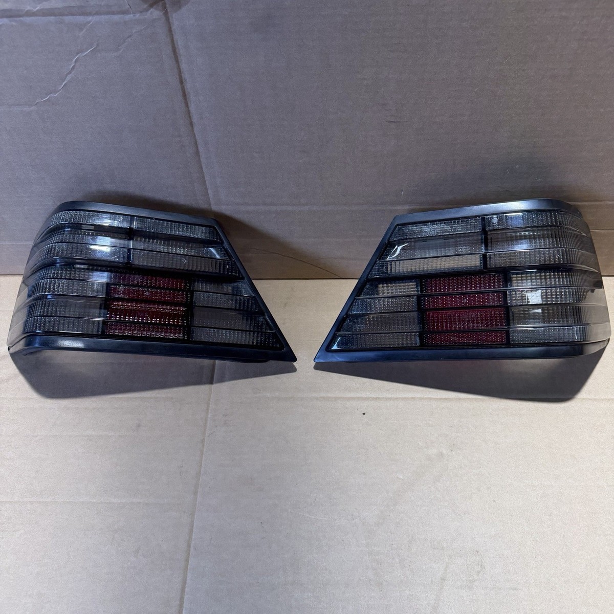 Taillight Assembly Set HELLA SMOKED BLACK Mercedes W124 Sedan