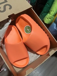 yeezy slide enflame orange on feet