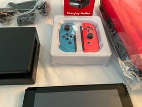 Nintendo Switch Console with Neon Blue and Neon Red Joy Cons with Extras
