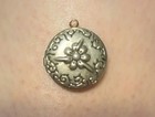Vintage Round Silvertone Stamped Flower Decorated Edge Locket Pendant  — photo 1