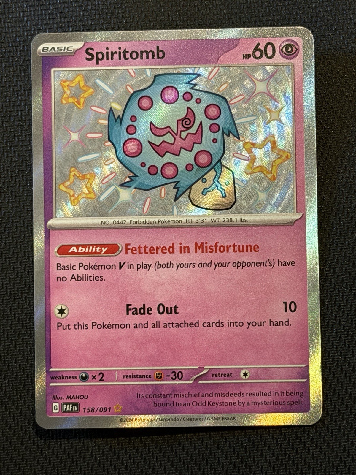 Spiritomb 158/091 SV: Paldean Fates Holo