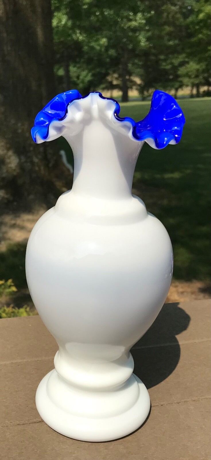 Fenton white pre logo vase with cobalt blue inside from Fentons