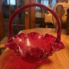 vintage Fenton Art Glass basket in a vibrant ruby red color.