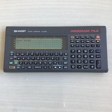 SHARP Pocket Computer PC-E200 Handheld Calculator with Battery Slots Tested